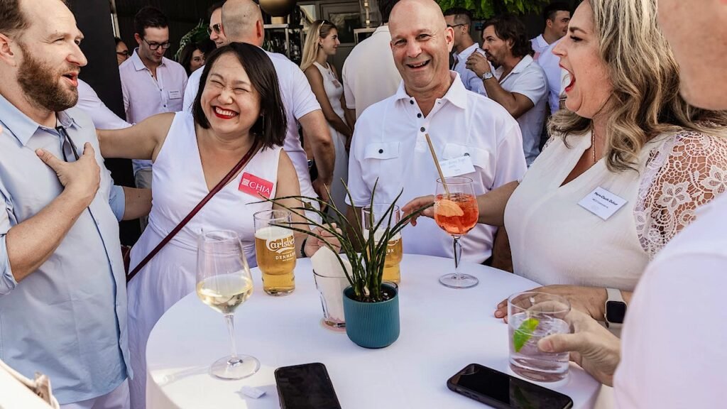 Real estate professionals, developers, investors, and brokers networking at the LEVIC Summer Real Estate Cocktail in Montréal.